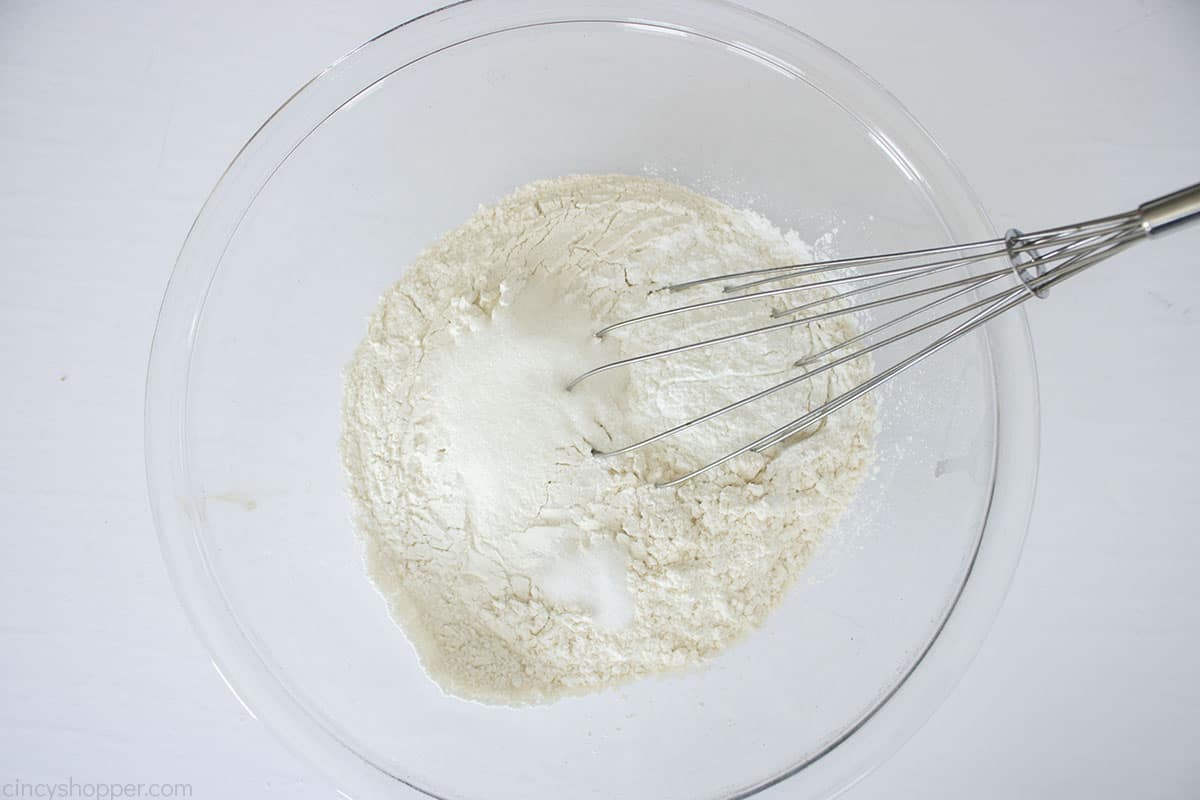 Flour, Baking Soda, sugar and salt in a mixing bowl with whisk.