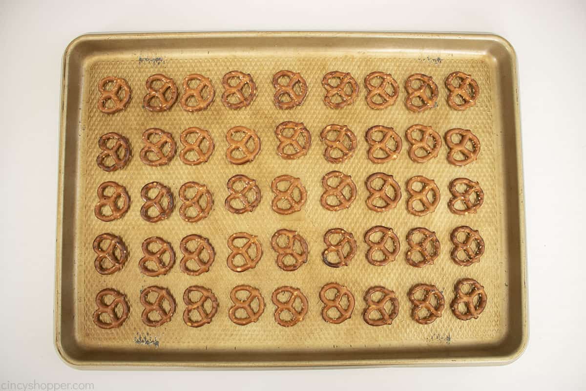 Mini pretzels on a baking sheet.