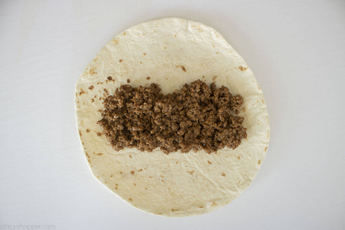 Soft tortilla with ground beef on top.