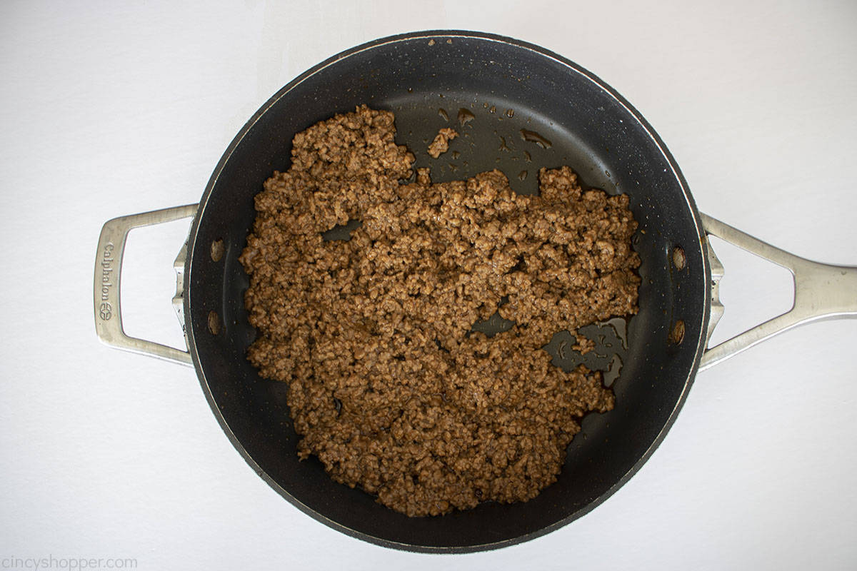 Cooked and drained taco meat in a pan.