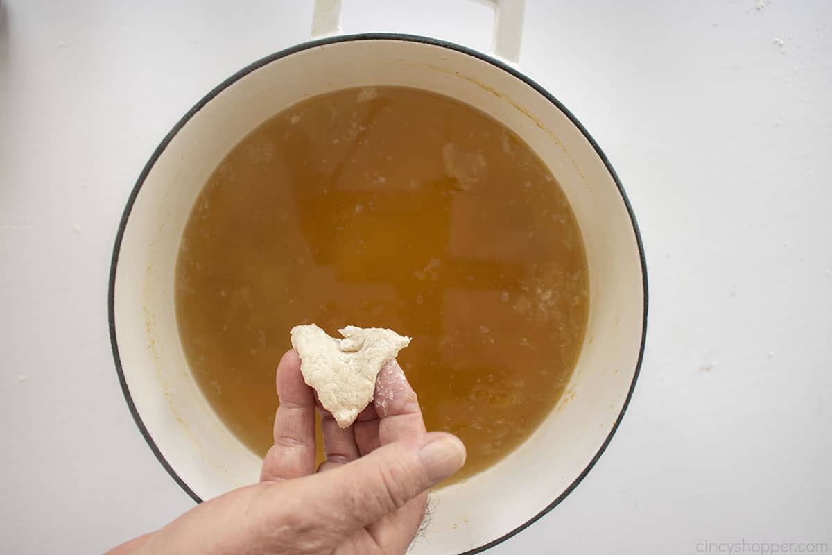 Homemade dumpling added to chicken broth.