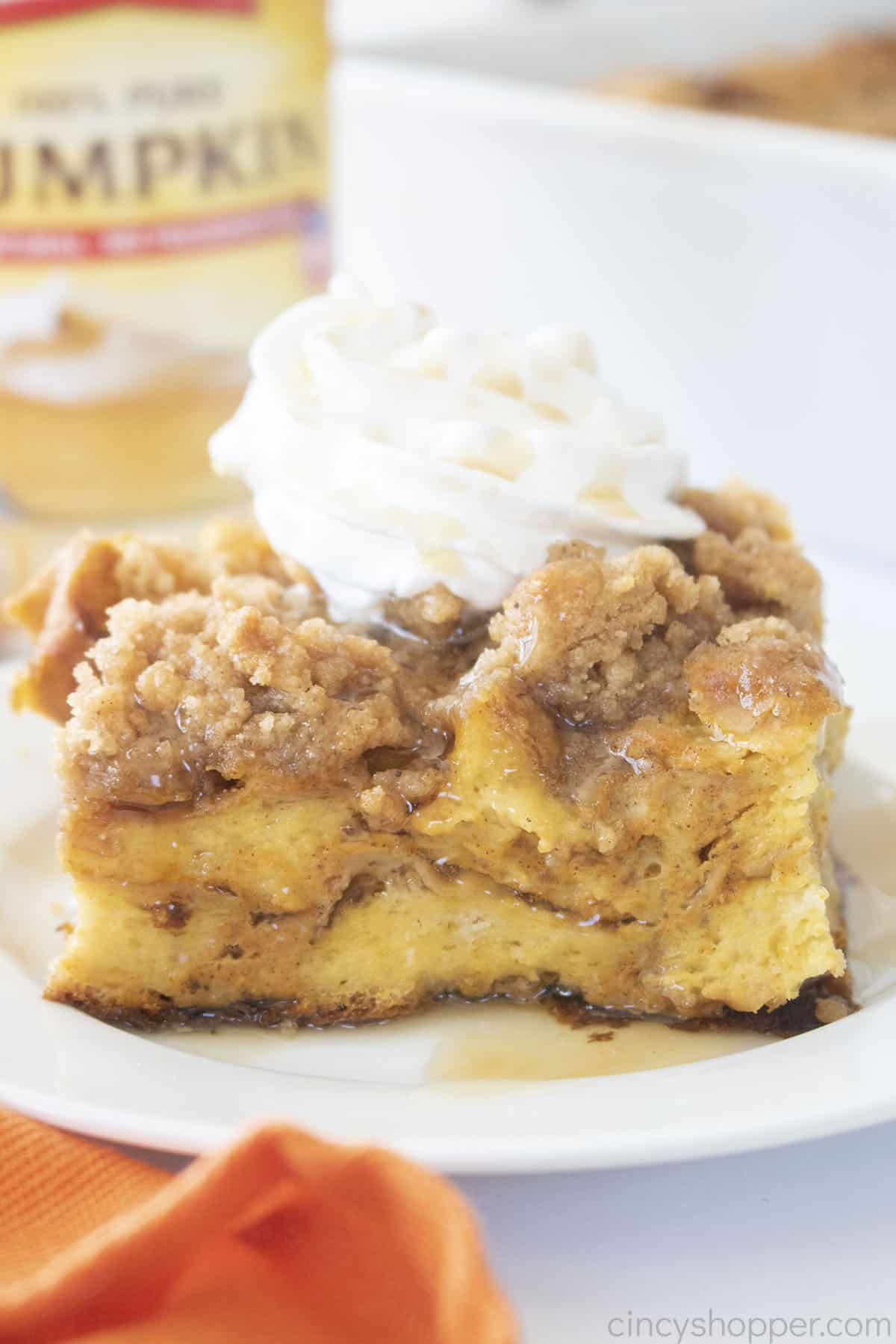 Piece of Pumpkin French Toast Casserole on a white plate.