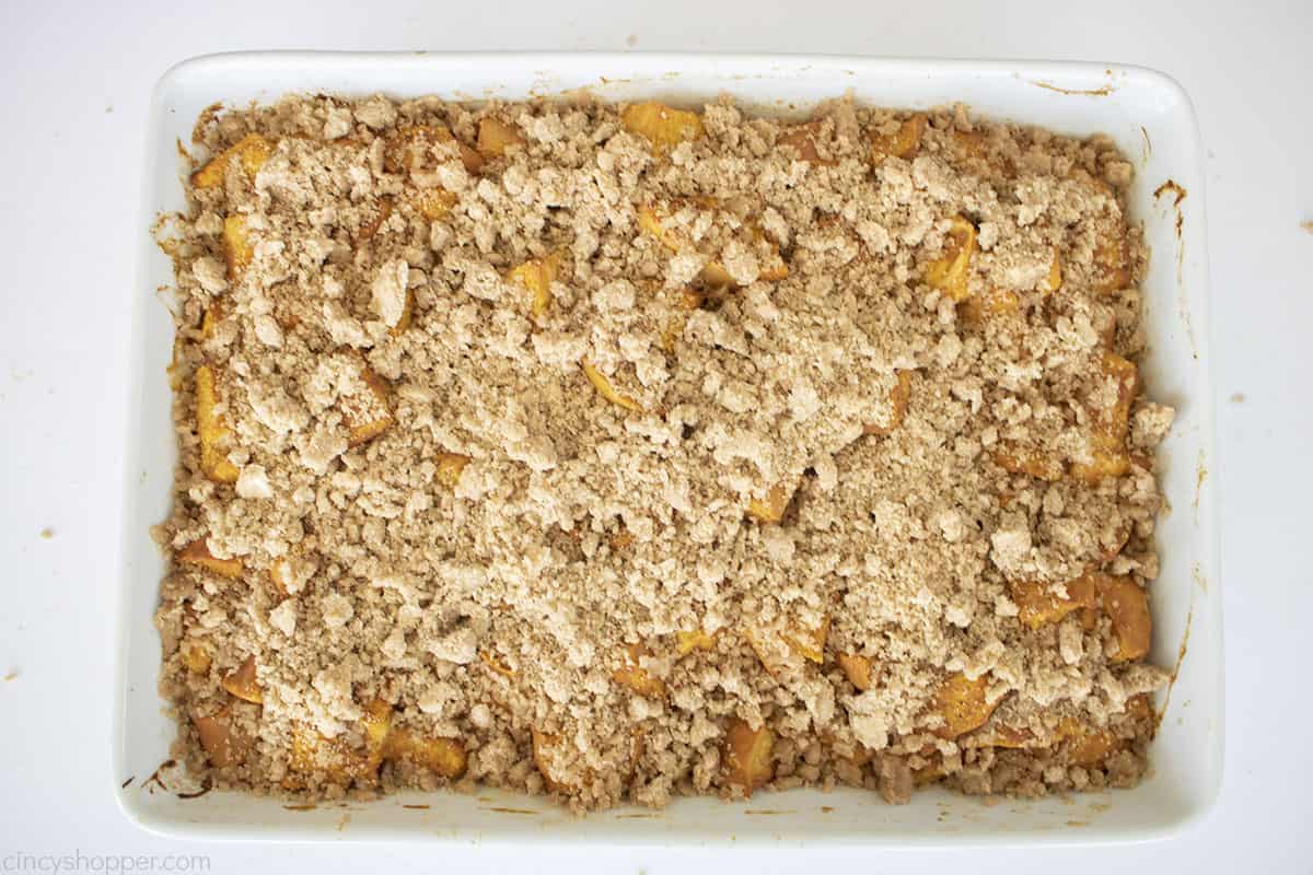 Crumb topping added to baked pumpkin french toast casserole.