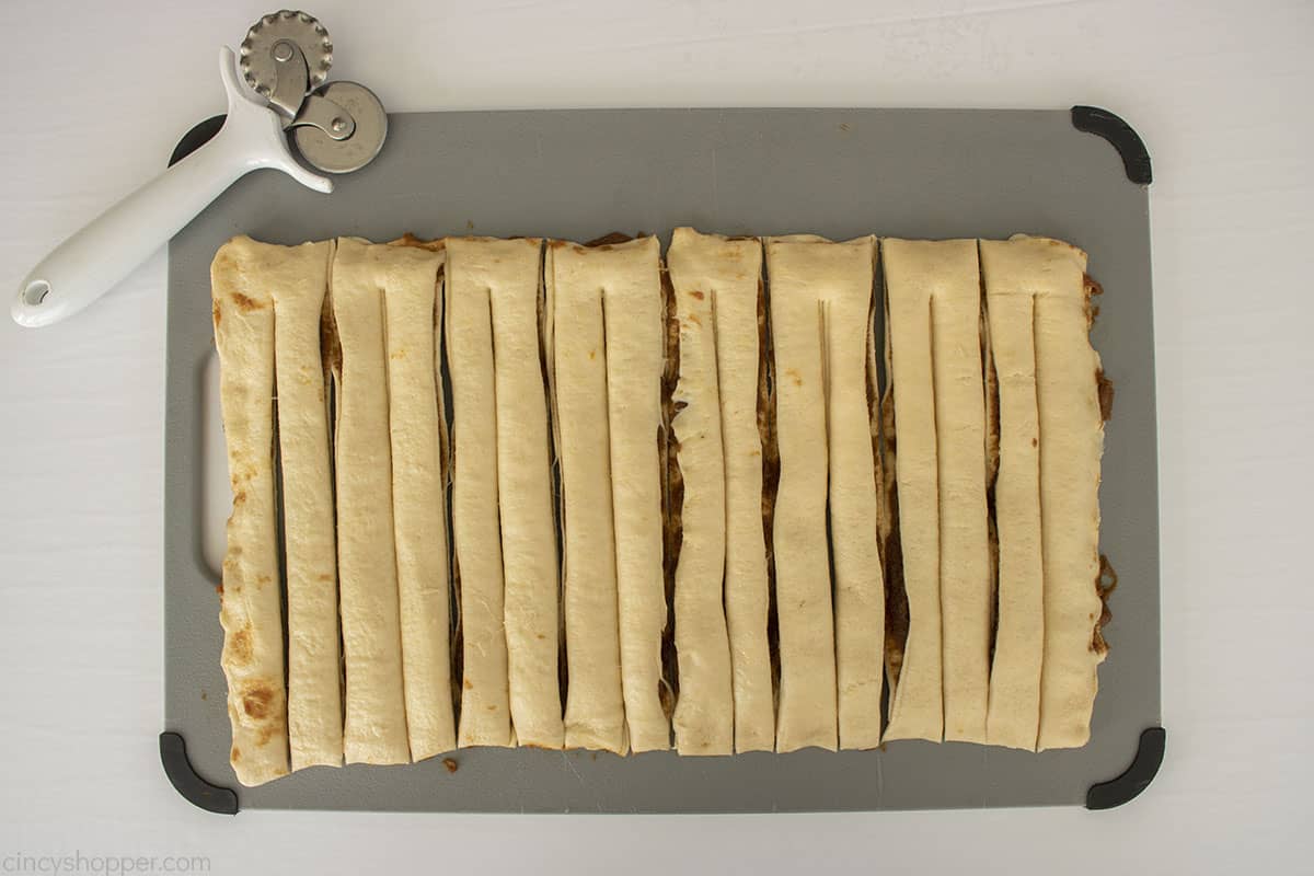 Pumpkin crescent dough cut again into twists.