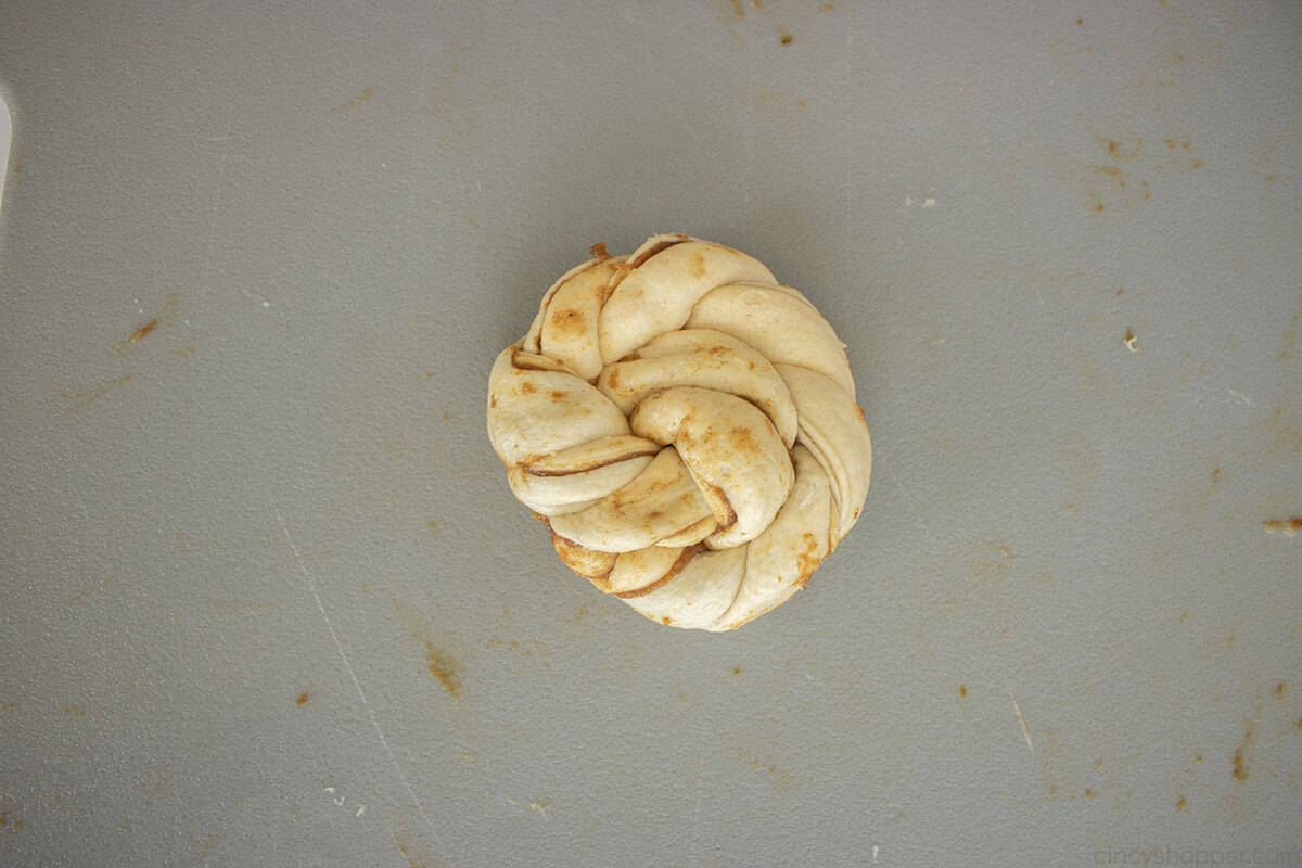 Pumpkin cinnamon roll knot tucked under.