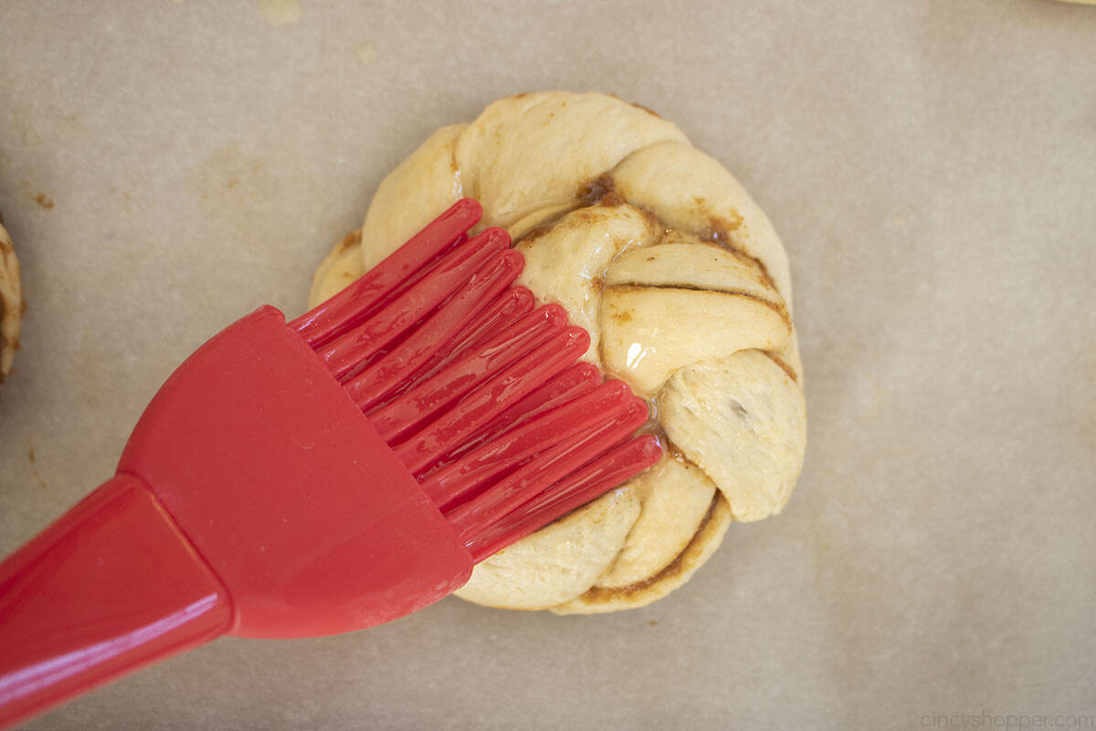 Butter brushed on top of Pumpkin roll.