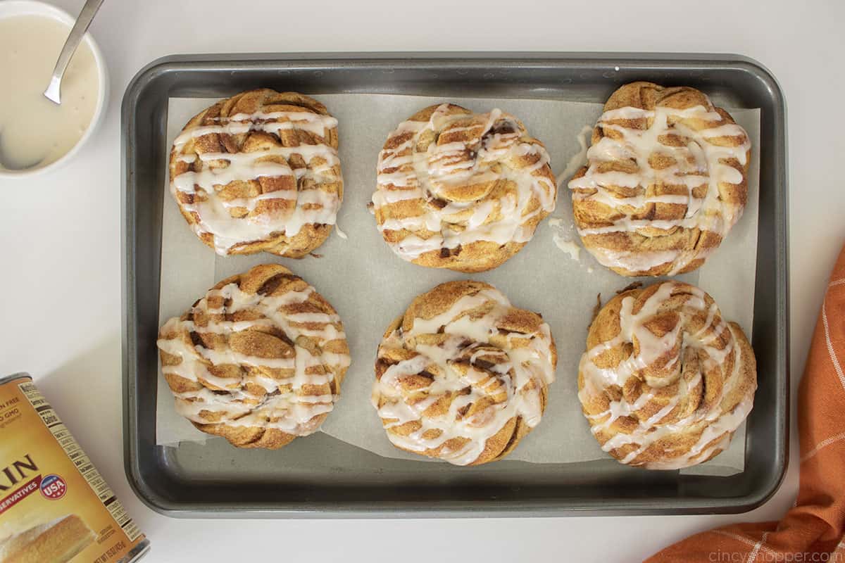 Fresh baked pumpkin twist rolls with icing.