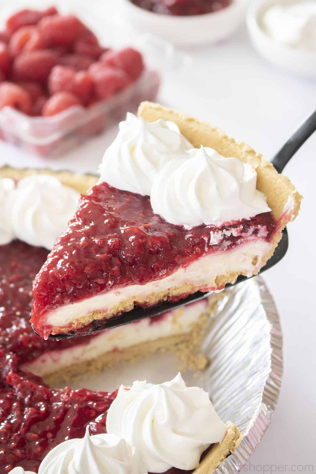 Slice of Raspberry Cream Pie on a server.