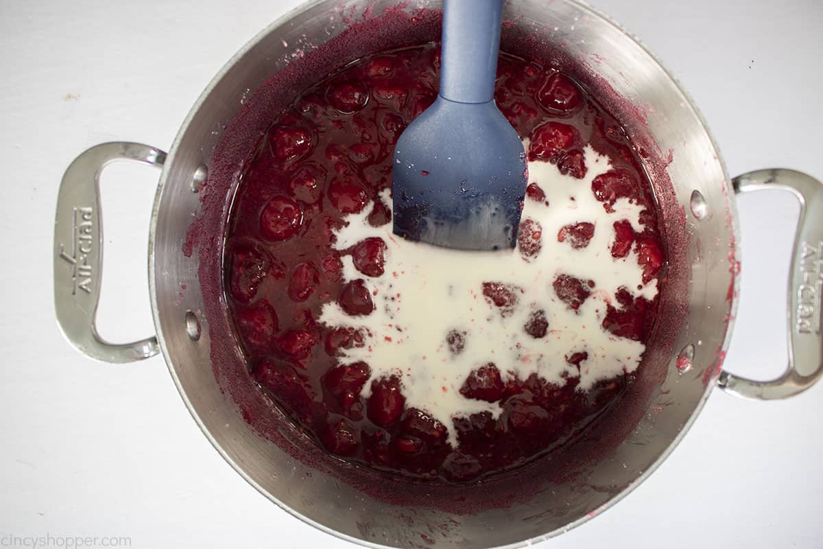 Cornstarch slurry added to cooked raspberries