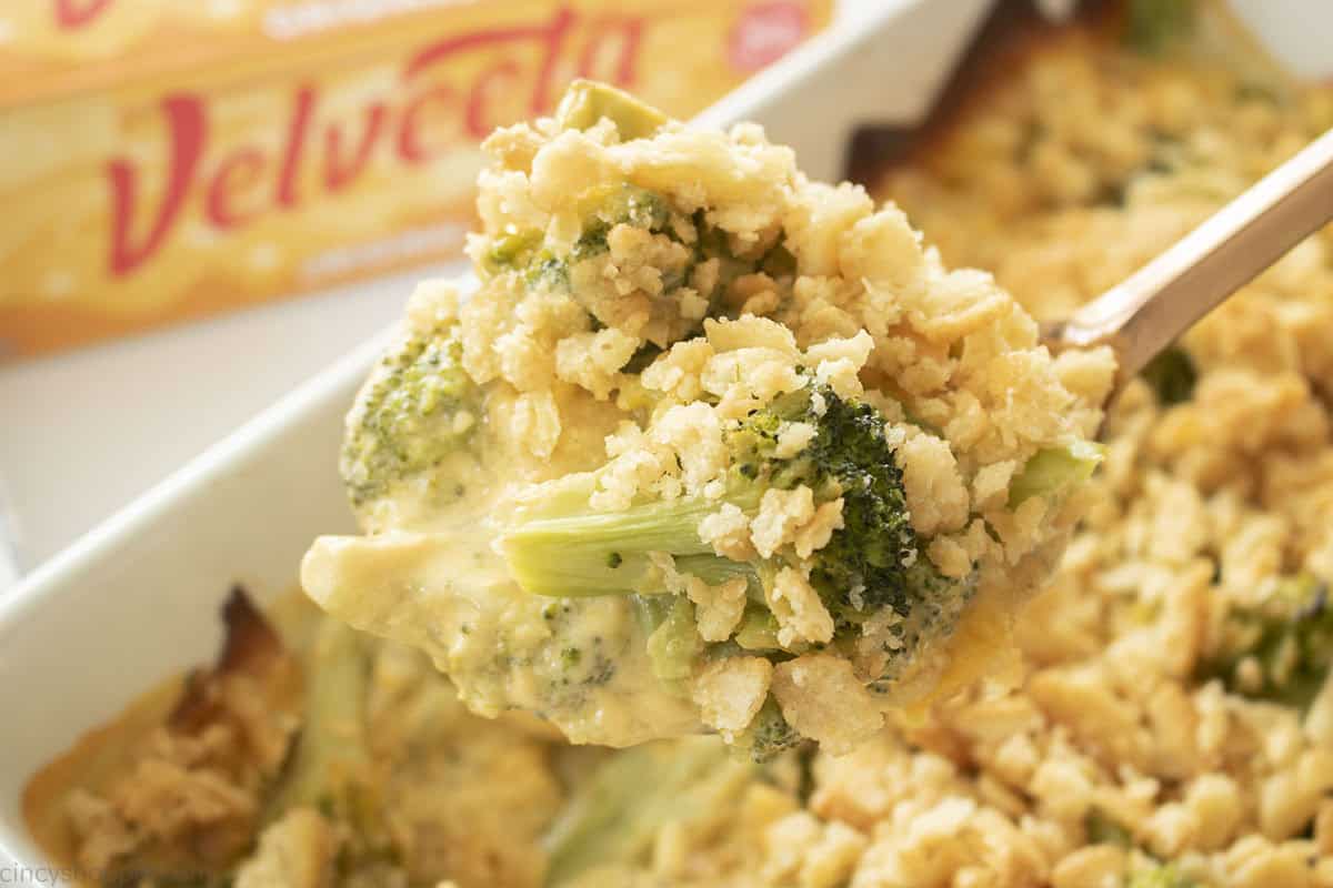 Spoon with Velveeta Broccoli Casserole with Ritz topping.