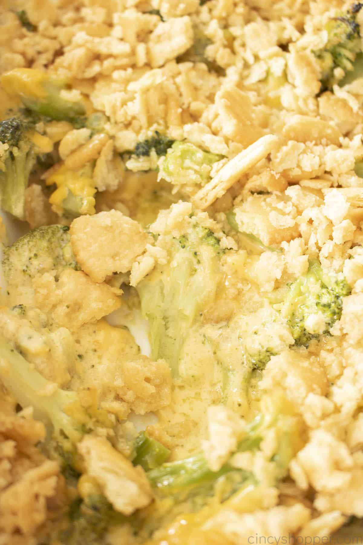 Broccoli and Cheese Casserole with Ritz Crackers closeup in dish.