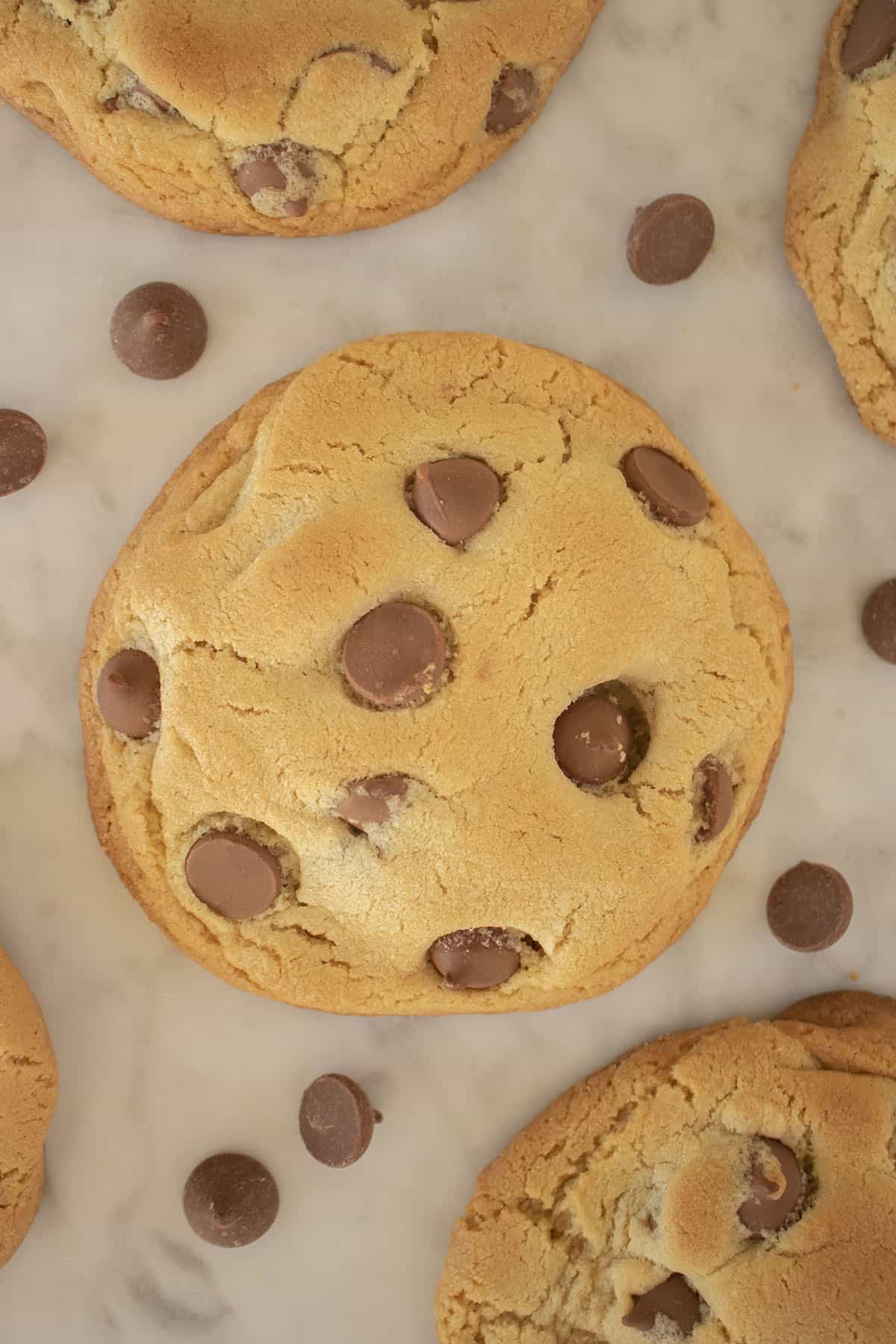 Crumbl Chocolate Chip Cookies on a marble board.