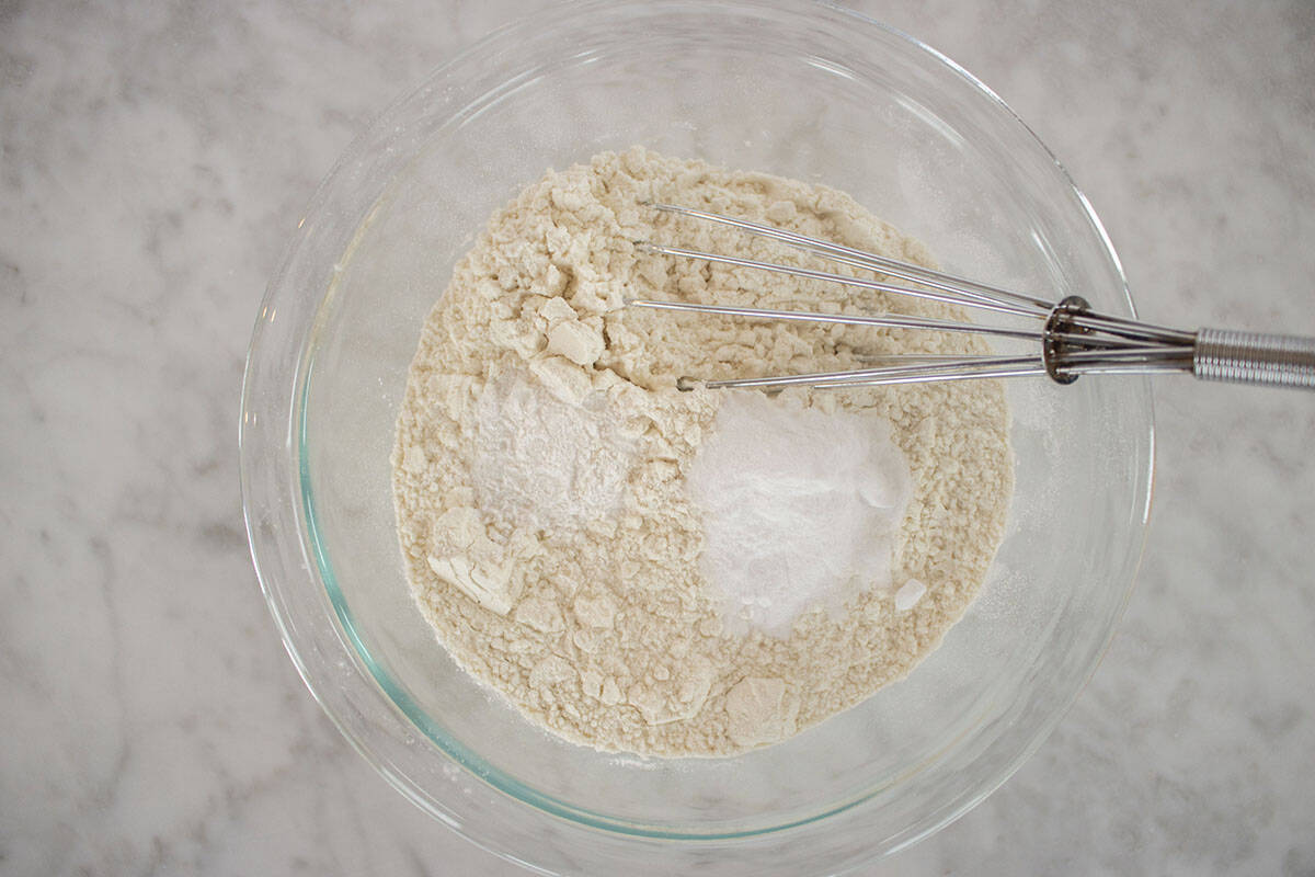 Cookie dry ingredients in a bowl with whisk.