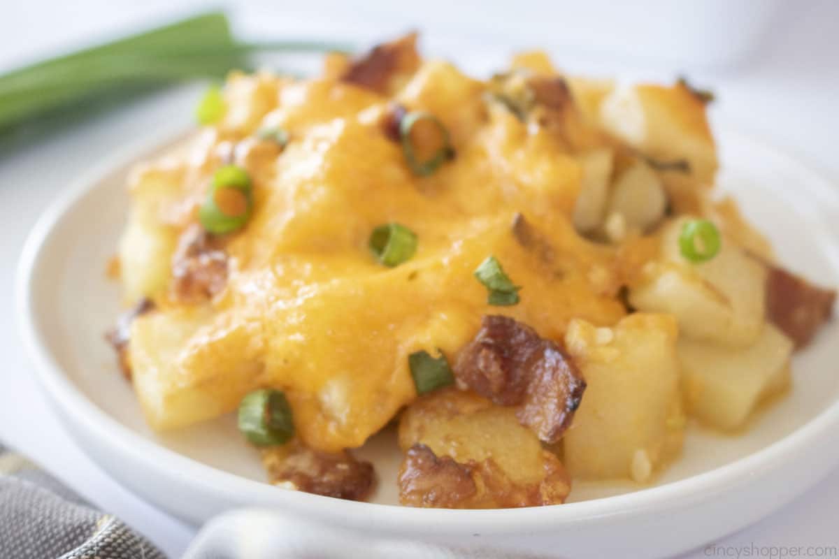 Cheesy Mississippi Mud Potatoes on a white plate. 