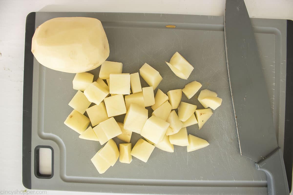 Diced potatoes on a cutting board.