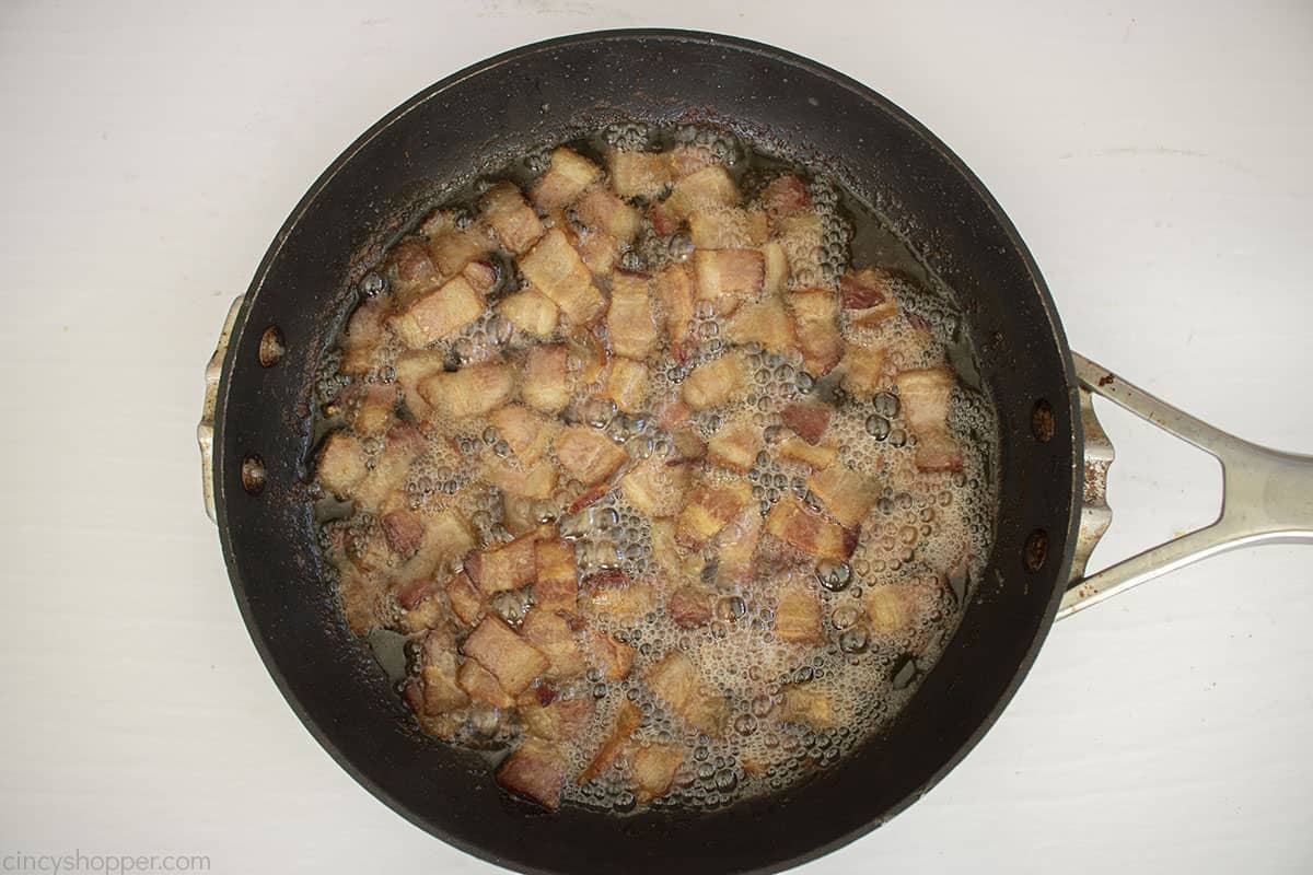 Bacon pieces in a frying pan