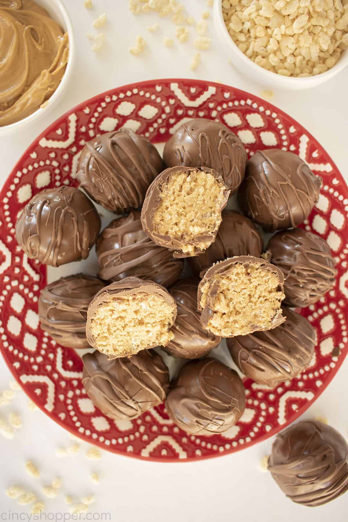Peanut Butter Rice Krispie Balls on a red Christmas plate.
