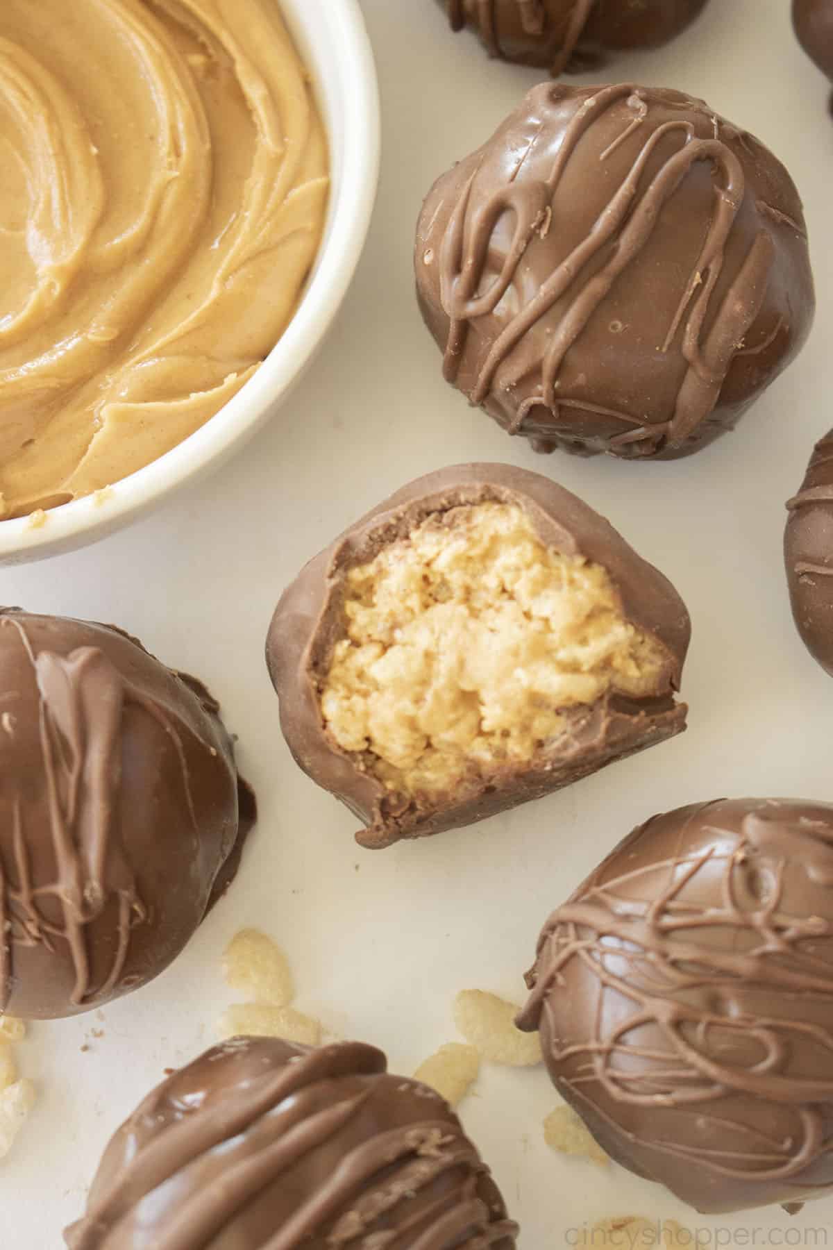 Peanut Butter Rice Krispie Balls with a bite.
