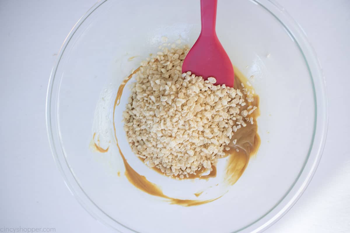 Rice Krispies cereal added to peanut butter mixture.