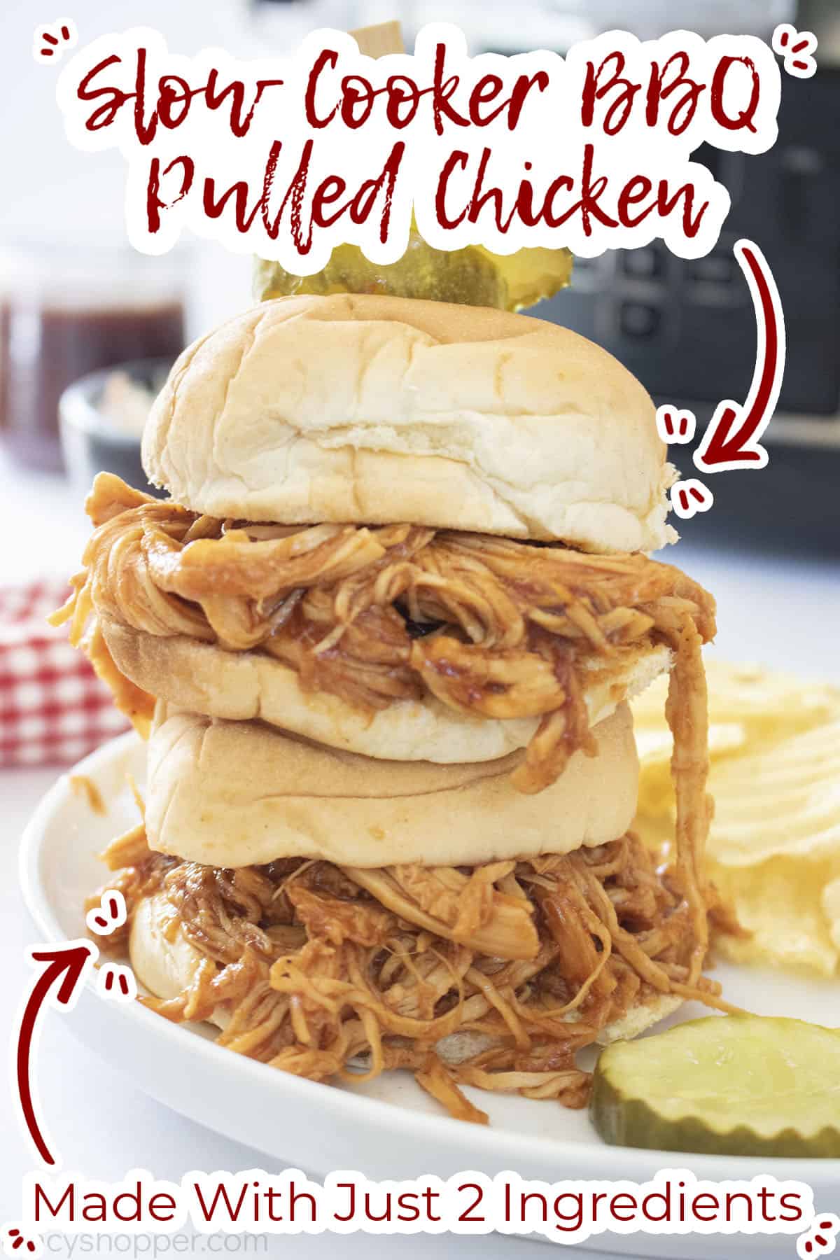 Stack of CrockPot BBQ Chicken Sliders on a plate with chips and pickle.