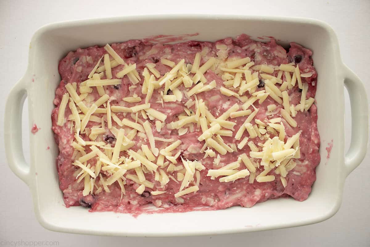 Shredded sharp cheddar cheese add to the top of the cranberry cream cheese mixture.