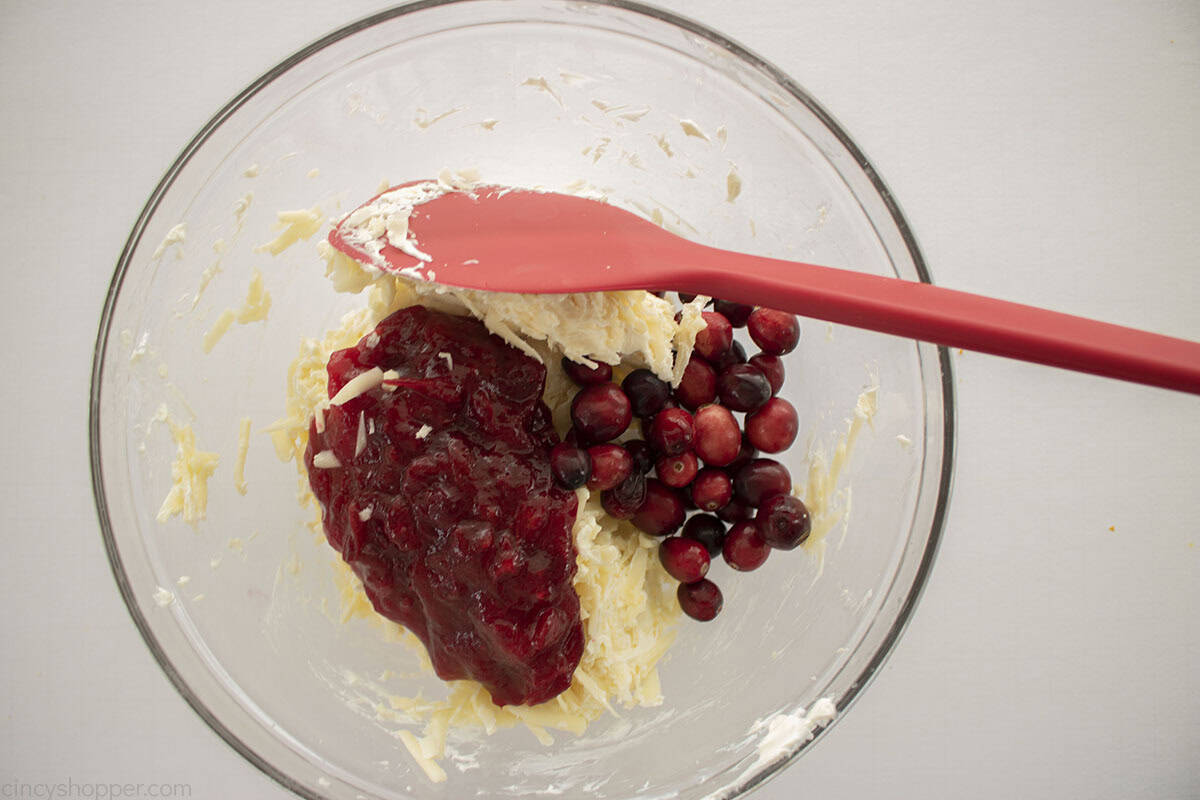 Cranberry sauce and fresh cranberries added to cheese mixture.