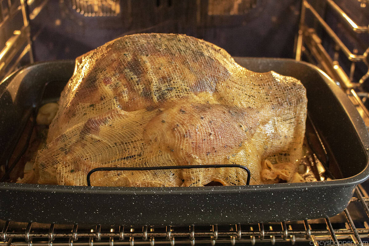 Cajun butter cheesecloth on top of roasted turkey.