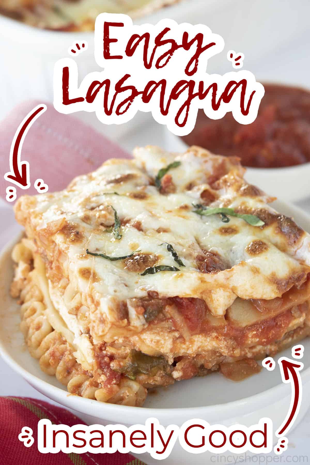 Piece of easy lasagna on a white plate with text on image - insanely good!