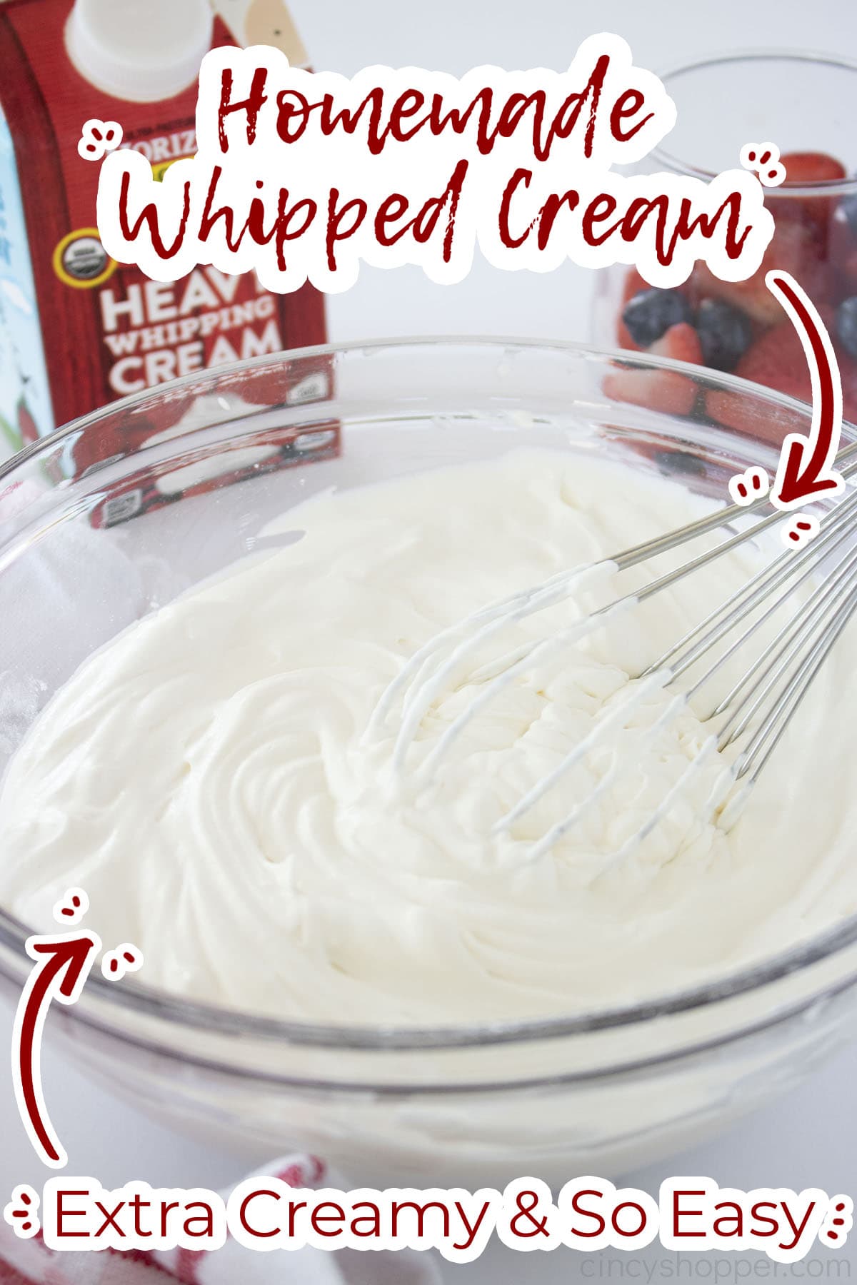 Homemade Whipped Cream on whisk and in clear mixing bowl.