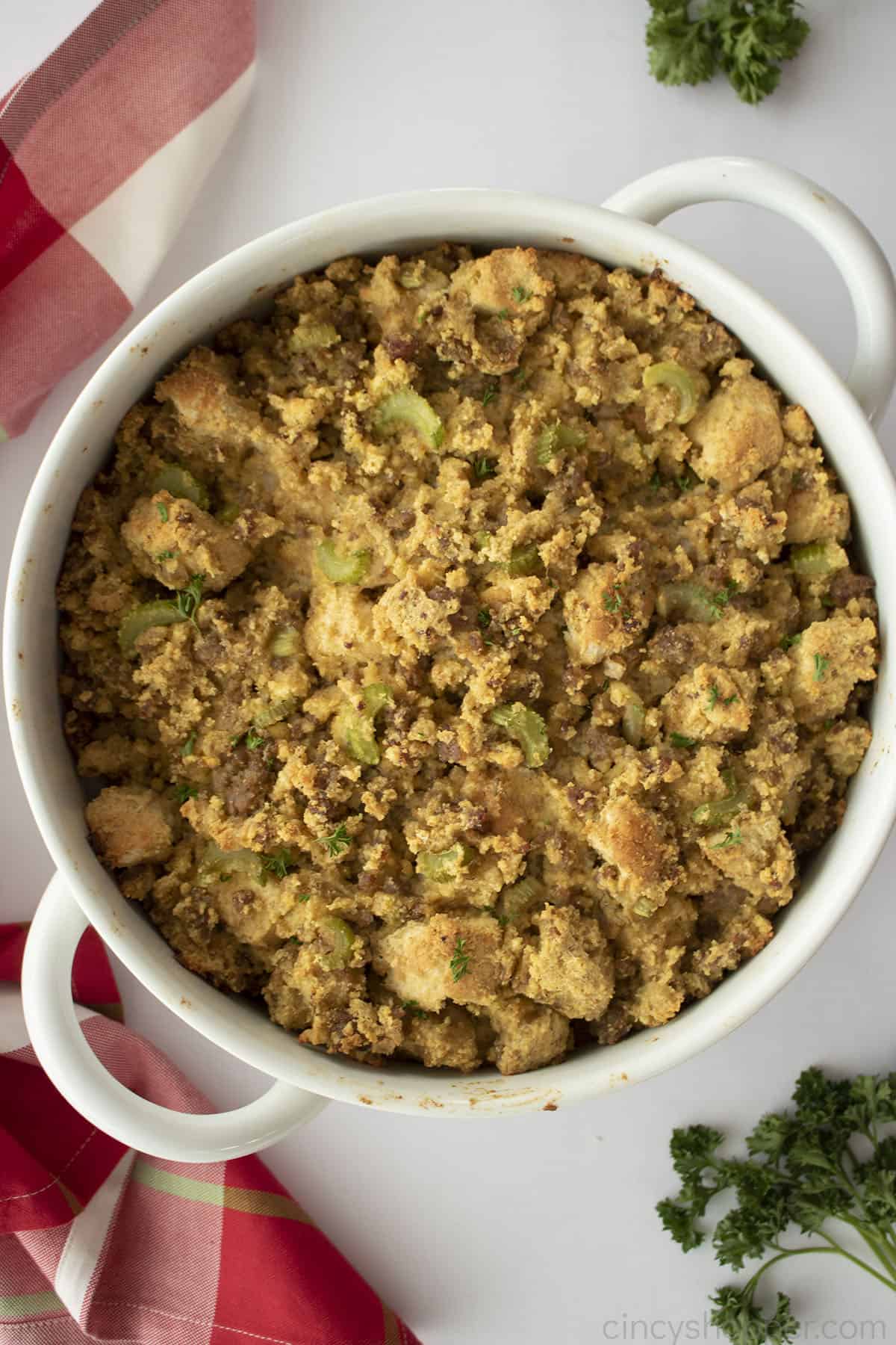 Jiffy Cornbread dressing in a white casserole dish.