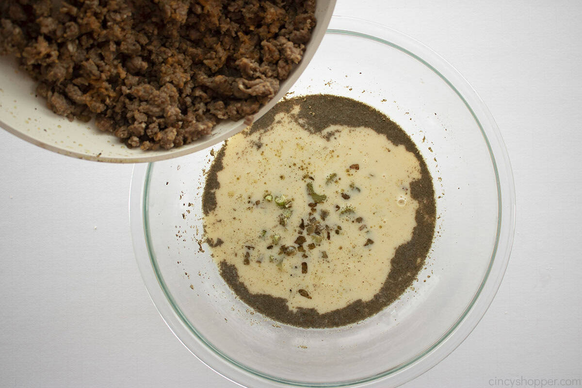 Cooked sausage added to milk mixture.