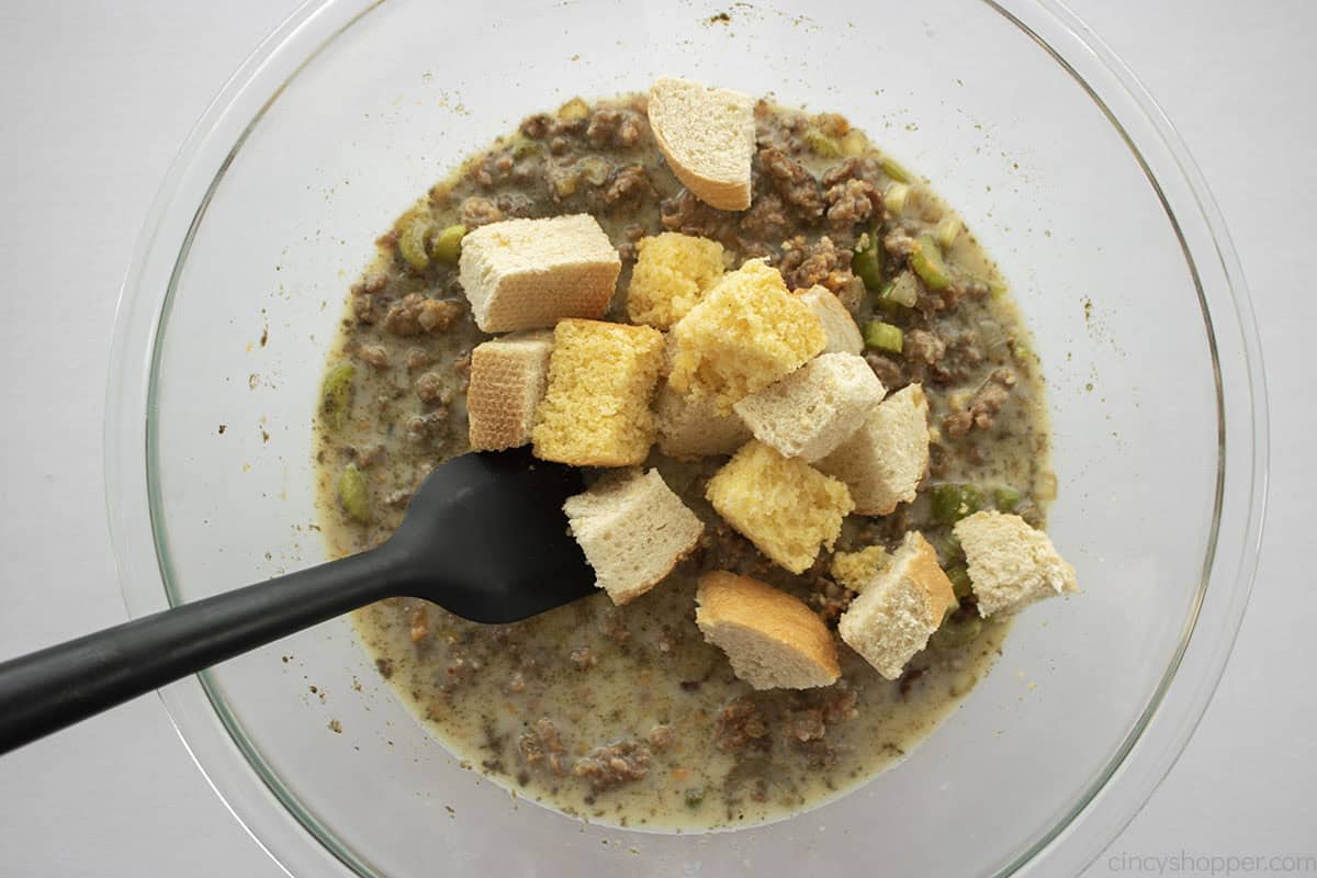Bread cubes added to milk and vegetable mixture.
