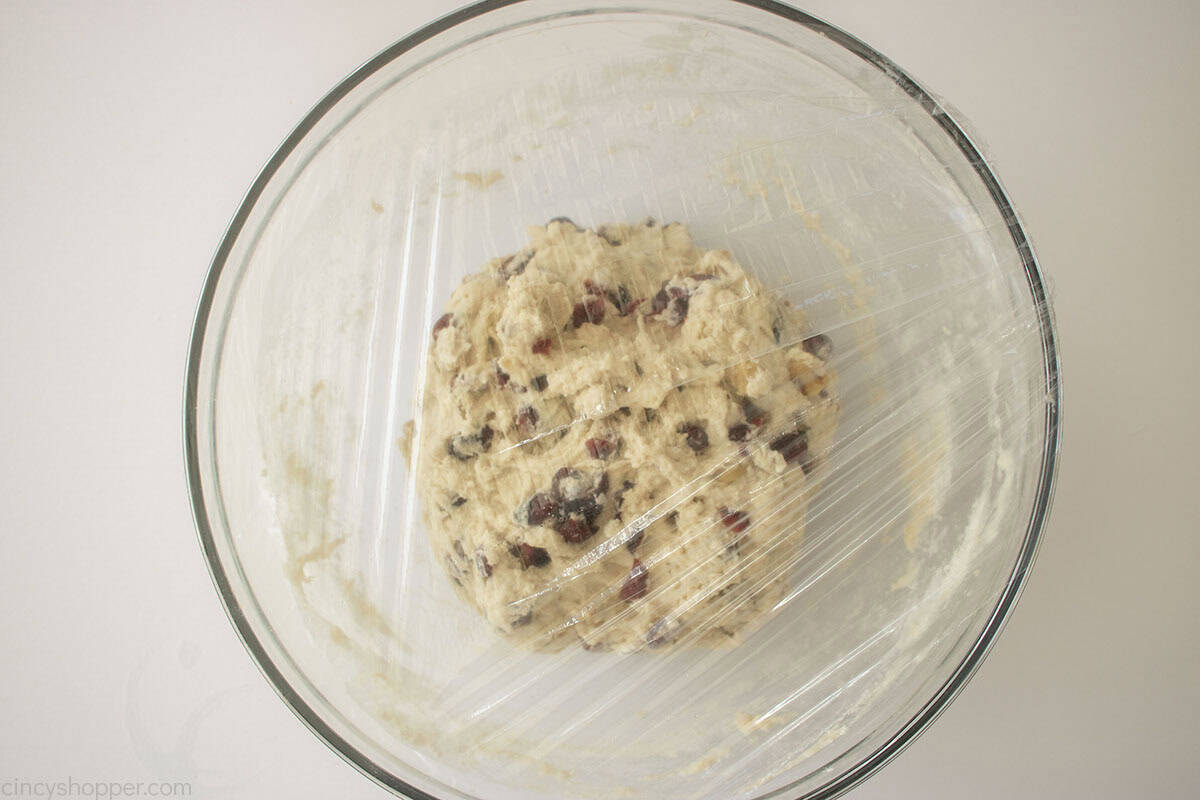 Bread dough covered with plastic wrap.