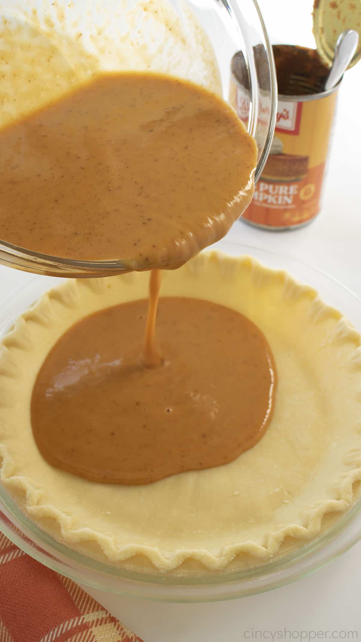 Pumpkin pie filling added to unbaked pie crust.