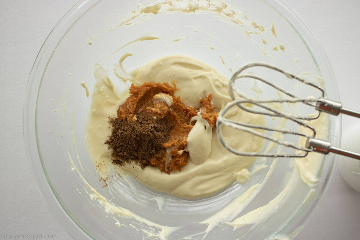Pumpkin and pumpkin pie spice added to remaining cream cheese mixture.