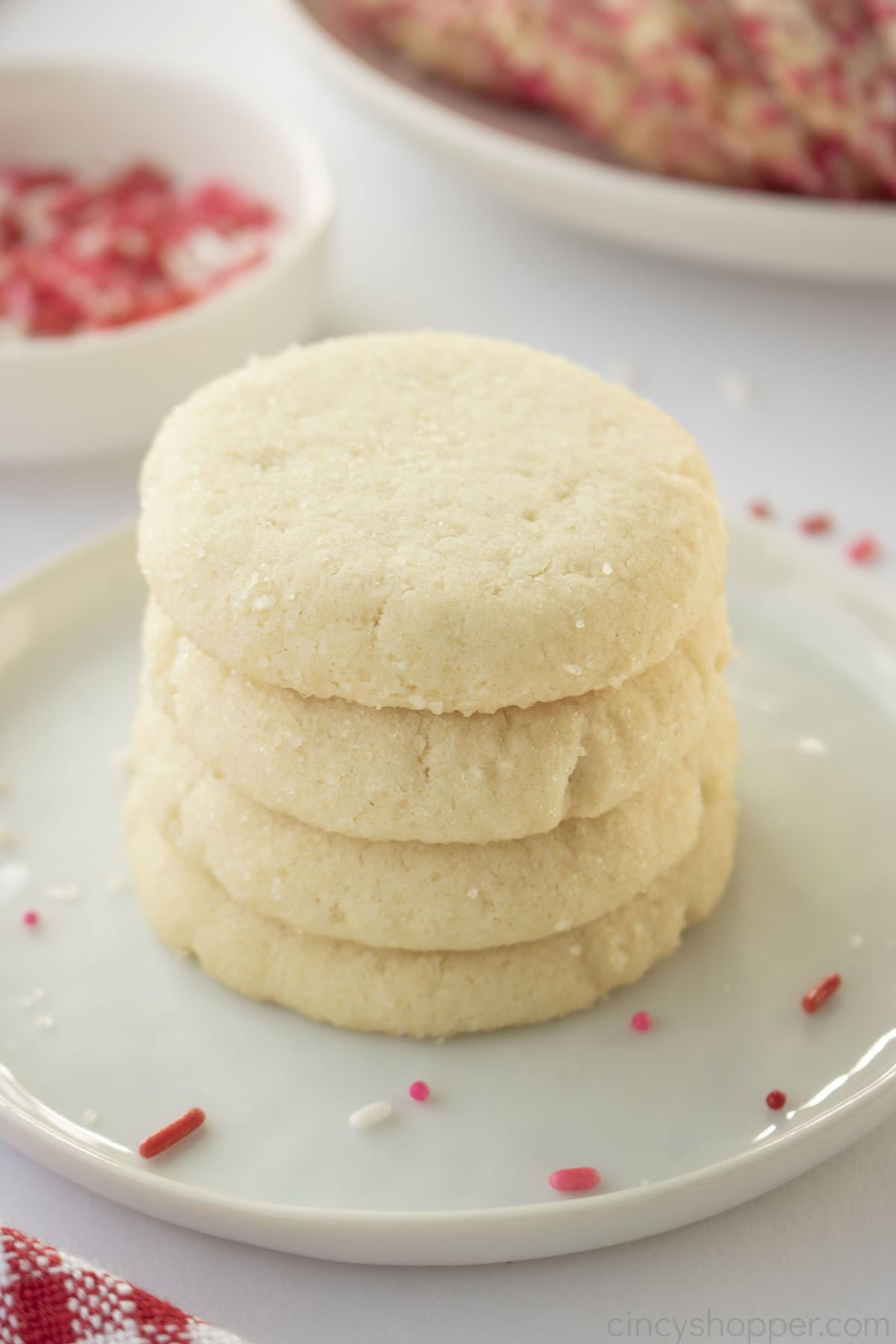 Stack of 3 Ingredient Sugar Cookie son a white plate with red and pink sprinkles.