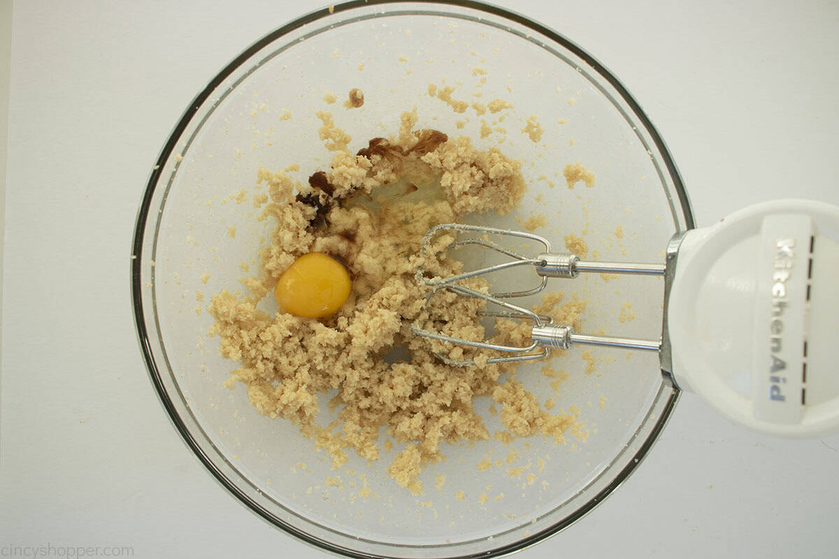 Egg, vanilla and apple cider added to sugar and egg mixture for cookies.