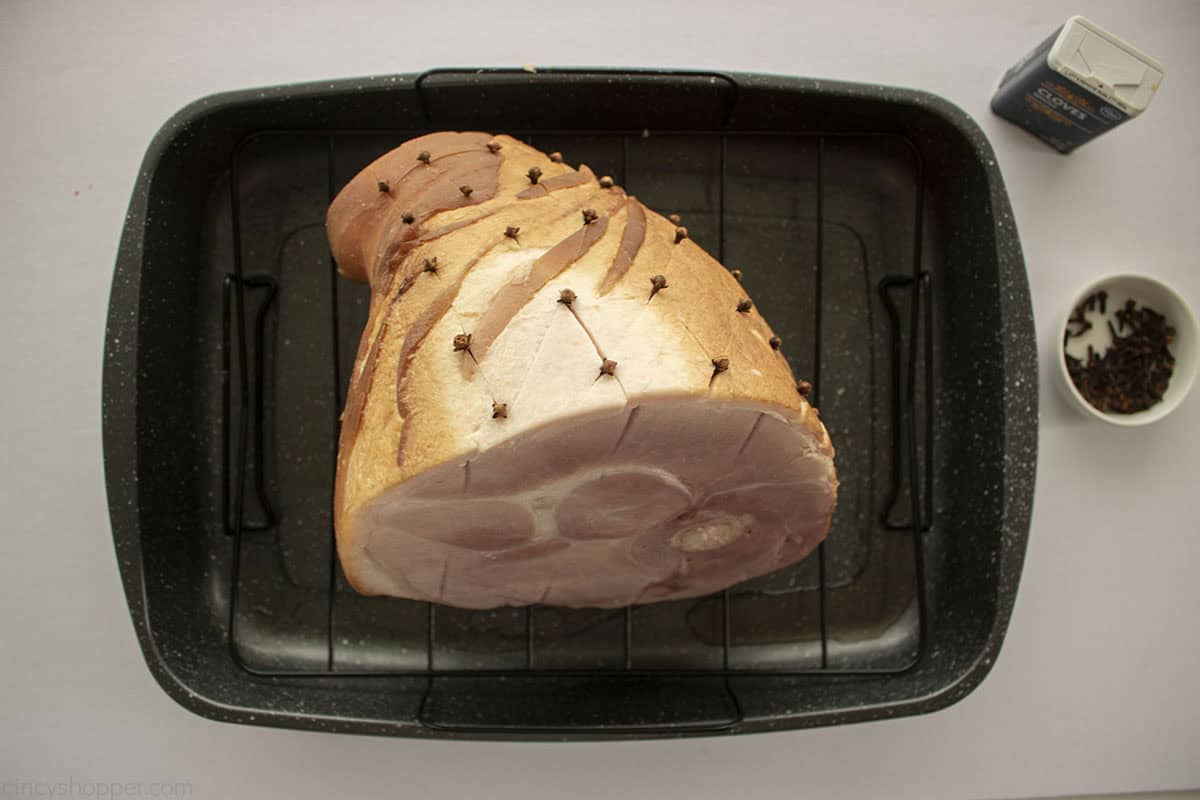 Cloves added to unbaked ham.
