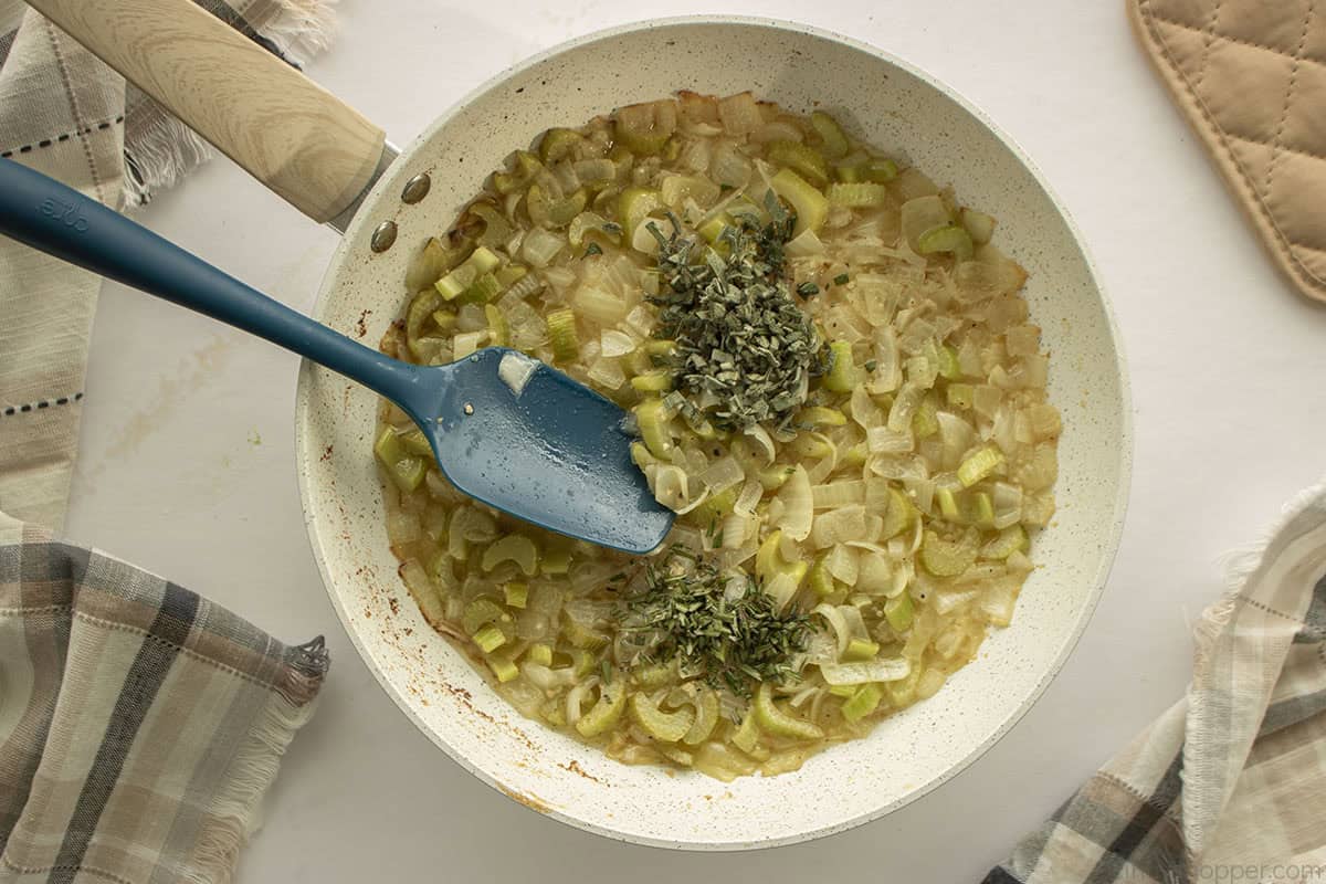Fresh herbs added to the celery, onion, butter and garlic mixture.