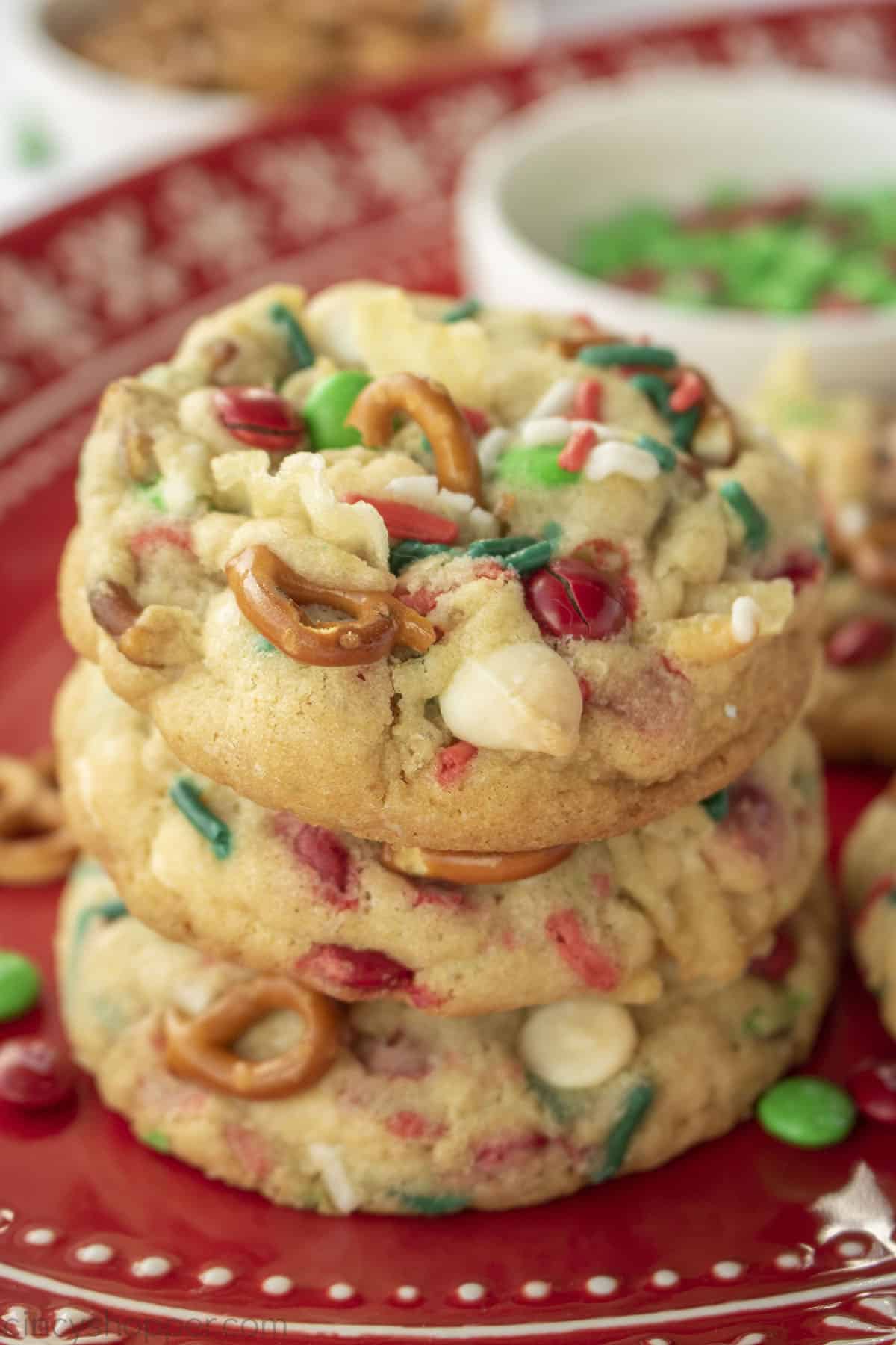 Christmas Kitchen Sink Cookies in a stack on a red platter.