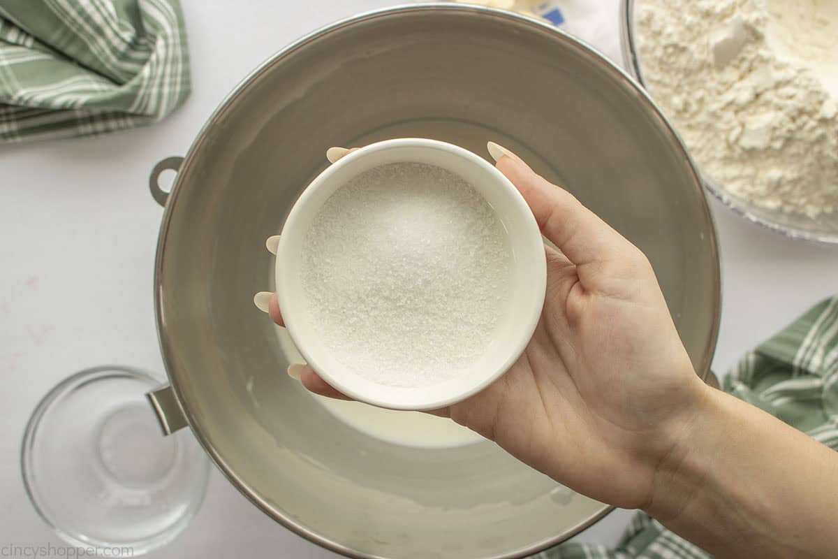 Remaining sugar added to milk mixture.