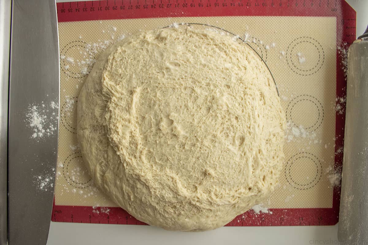 Dough on a floured surface.