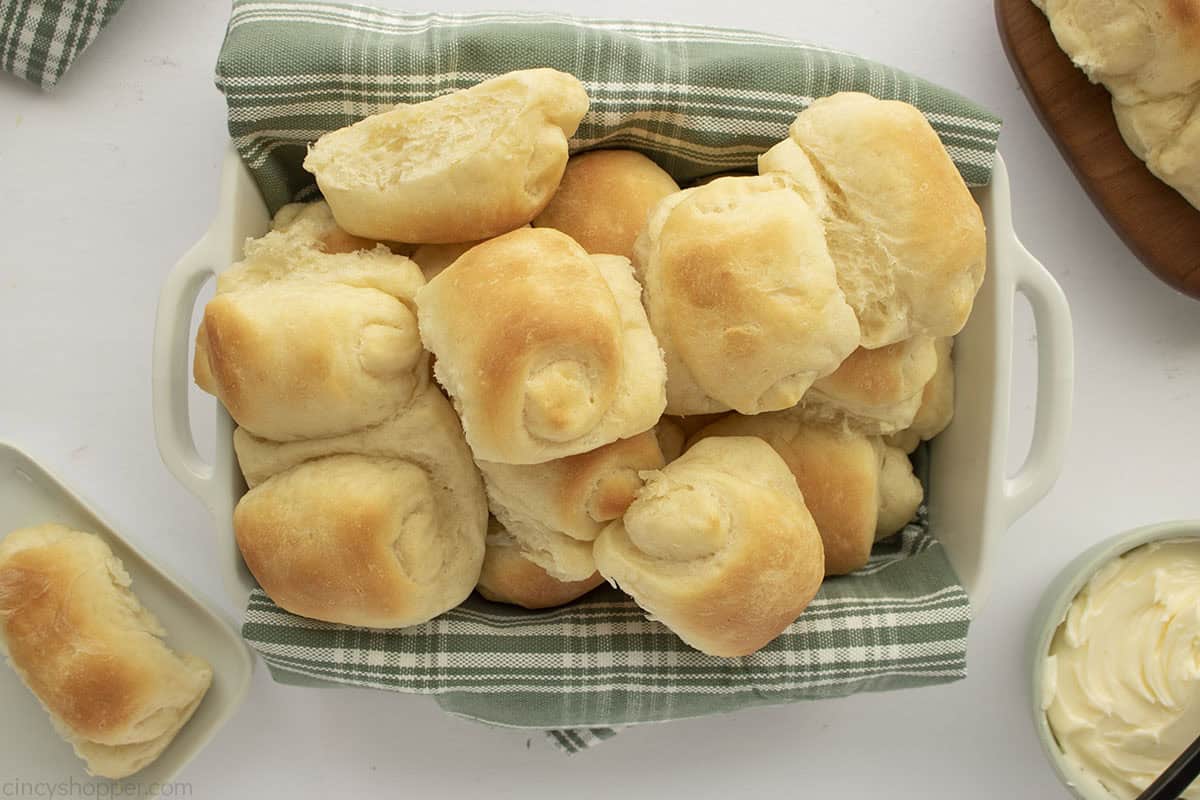 Dish filled with dinner rolls.