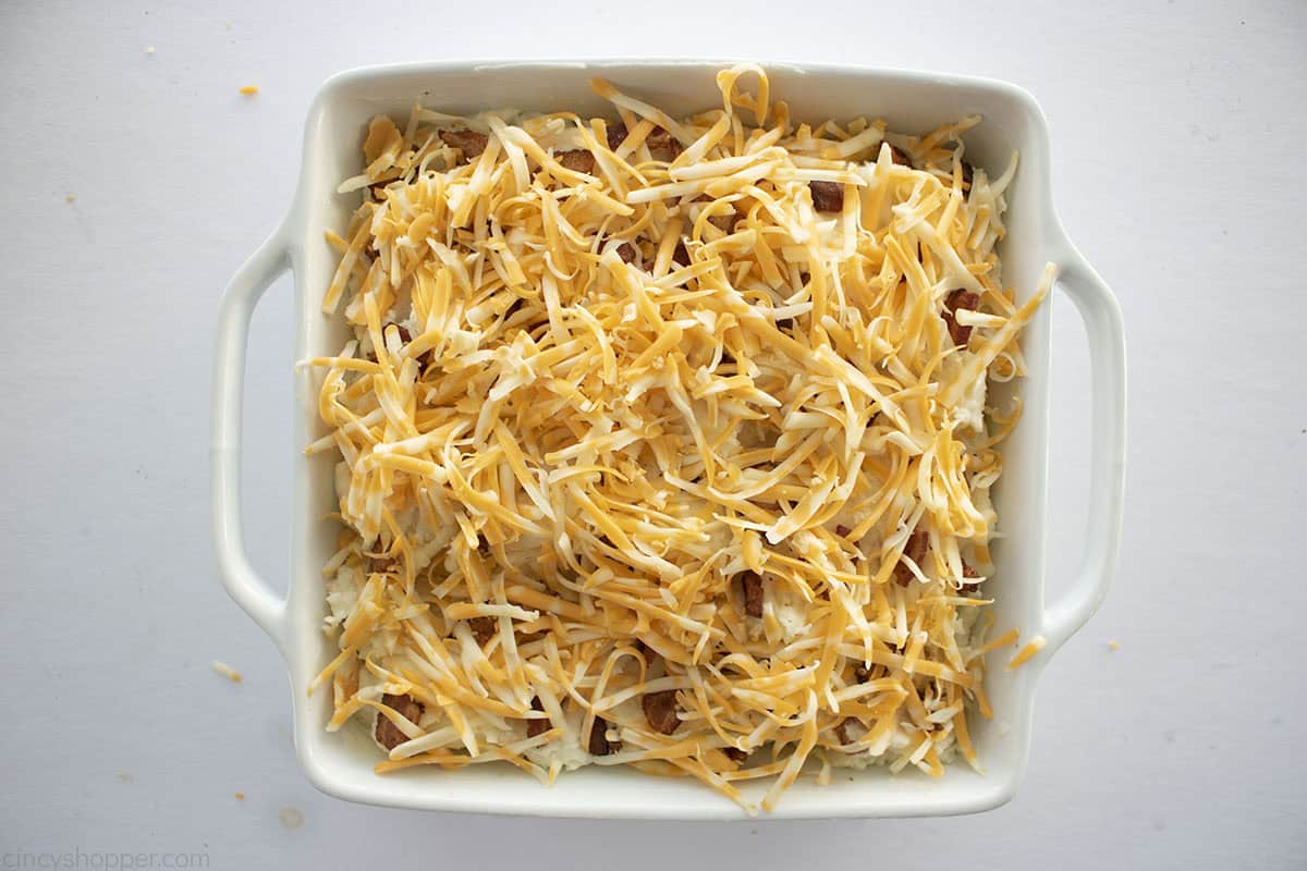 Cheese topping added to the top of mashed potato casserole.