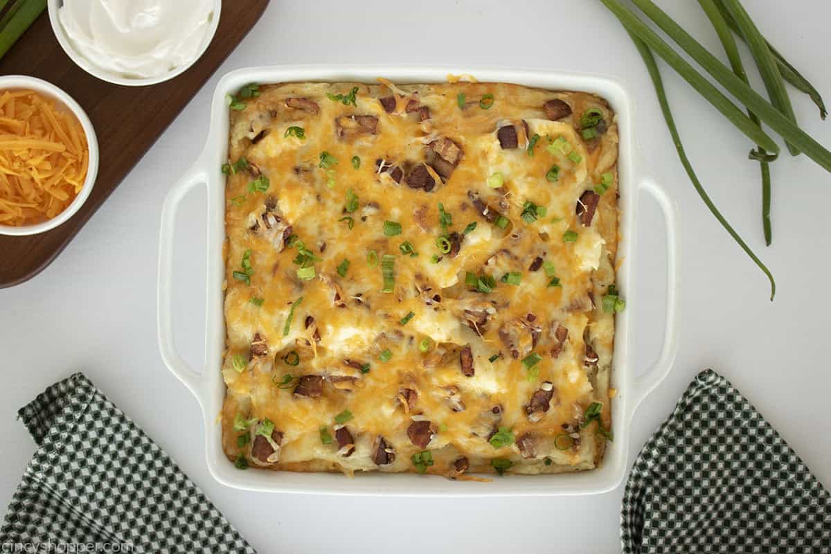 Baked mashed potato casserole in a white dish.
