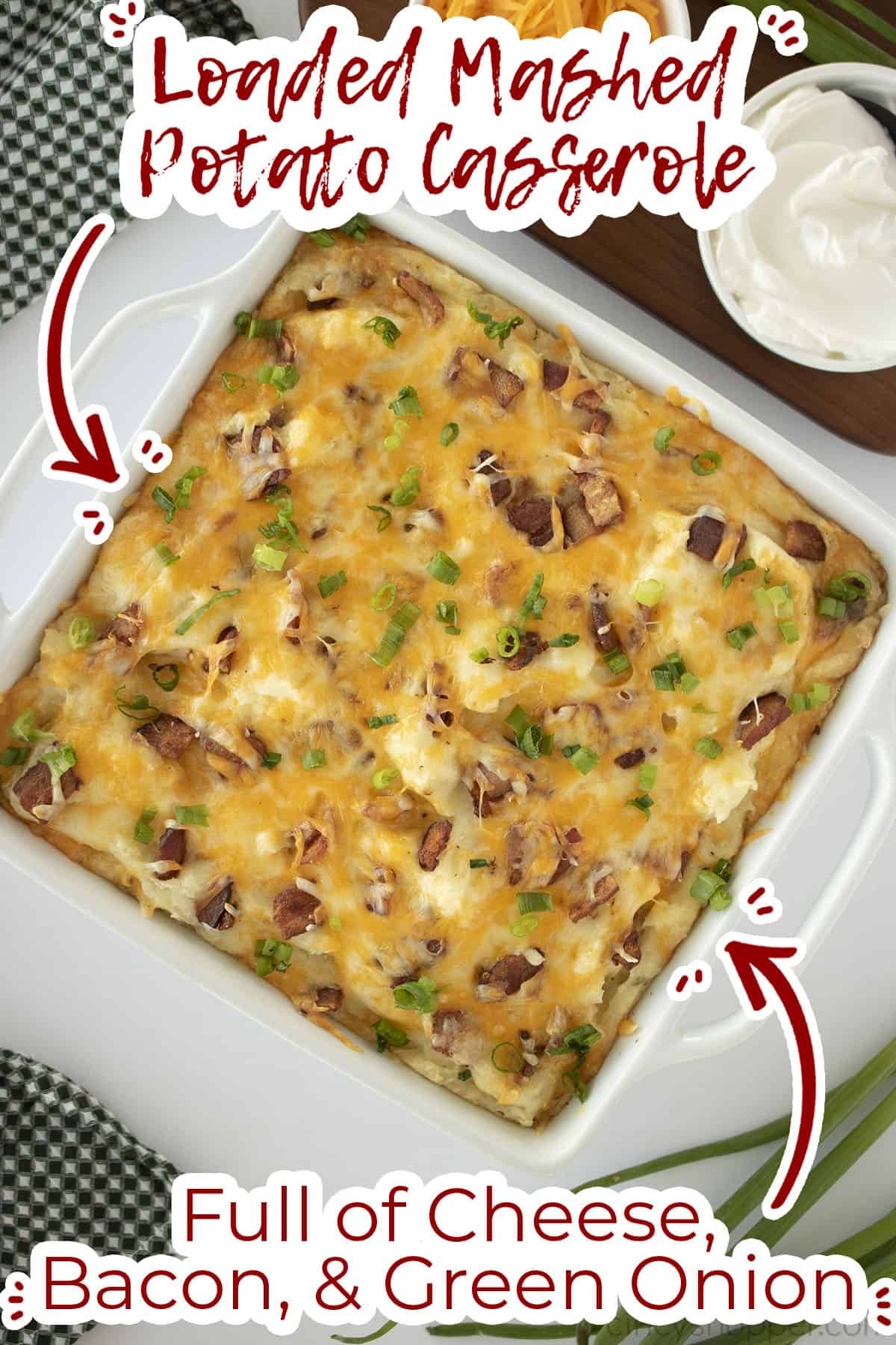 Overhead of potato casserole with text on image full of cheese, bacon and green onion. 