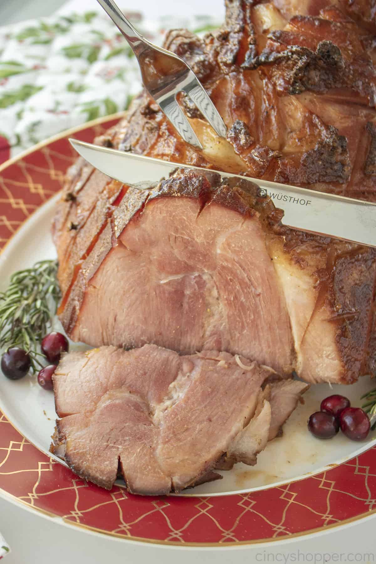 Maple Glazed ham being carved.