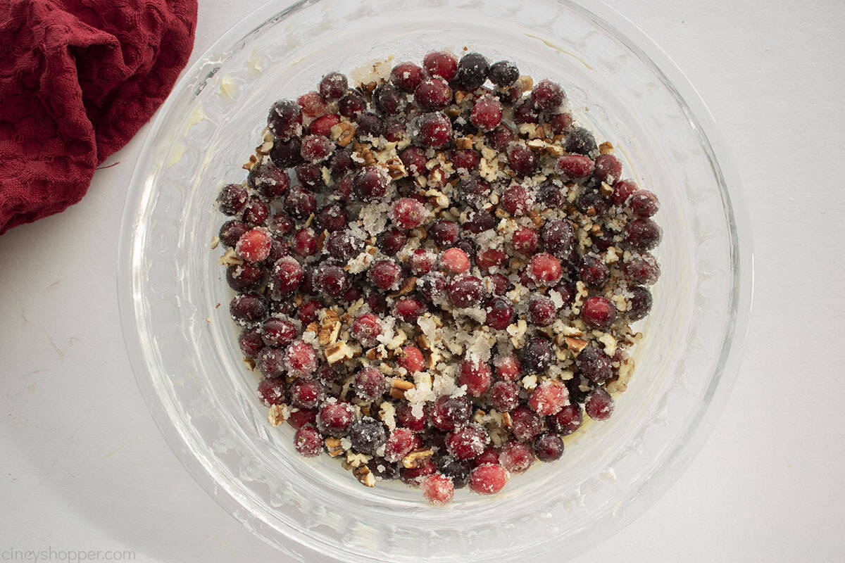 Cranberry mixture added to the bottom of a clear pie dish.