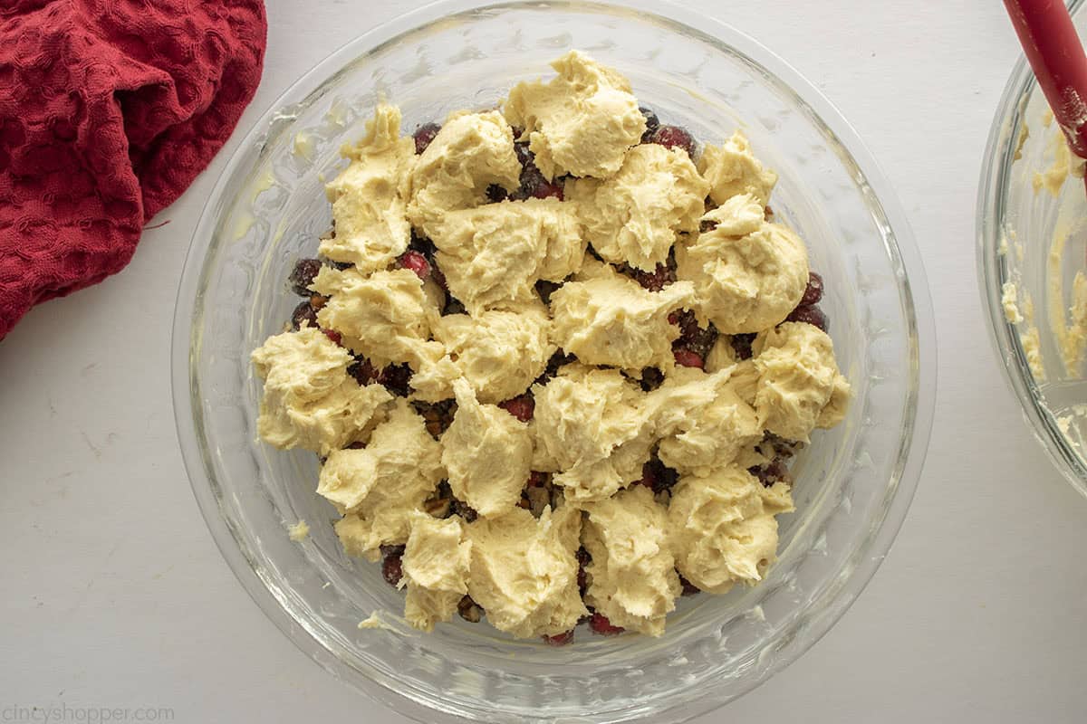 Batter mixture dollops added to the top of the cranberry mixture.