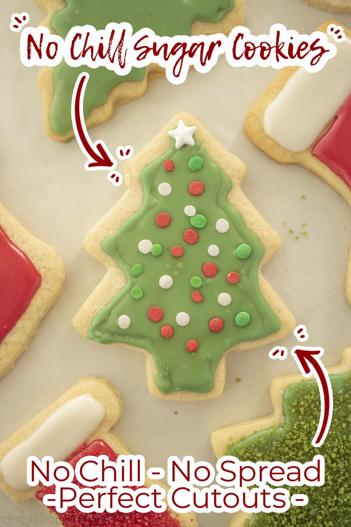 Icing topped tree cookie with text No Chill, No Spread, Perfect Cutouts.